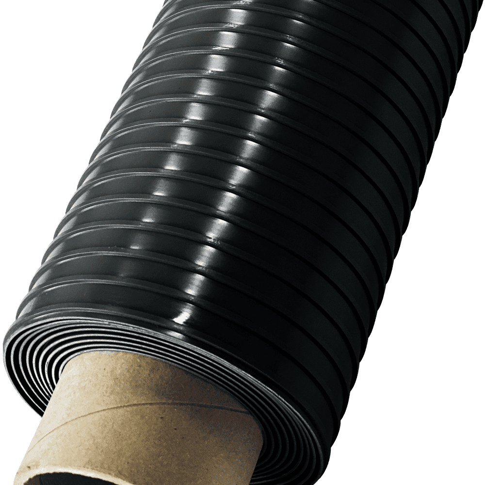 Close Up View Of Black Ribbed Roll Out Flooring Wound Around A Cardboard Core