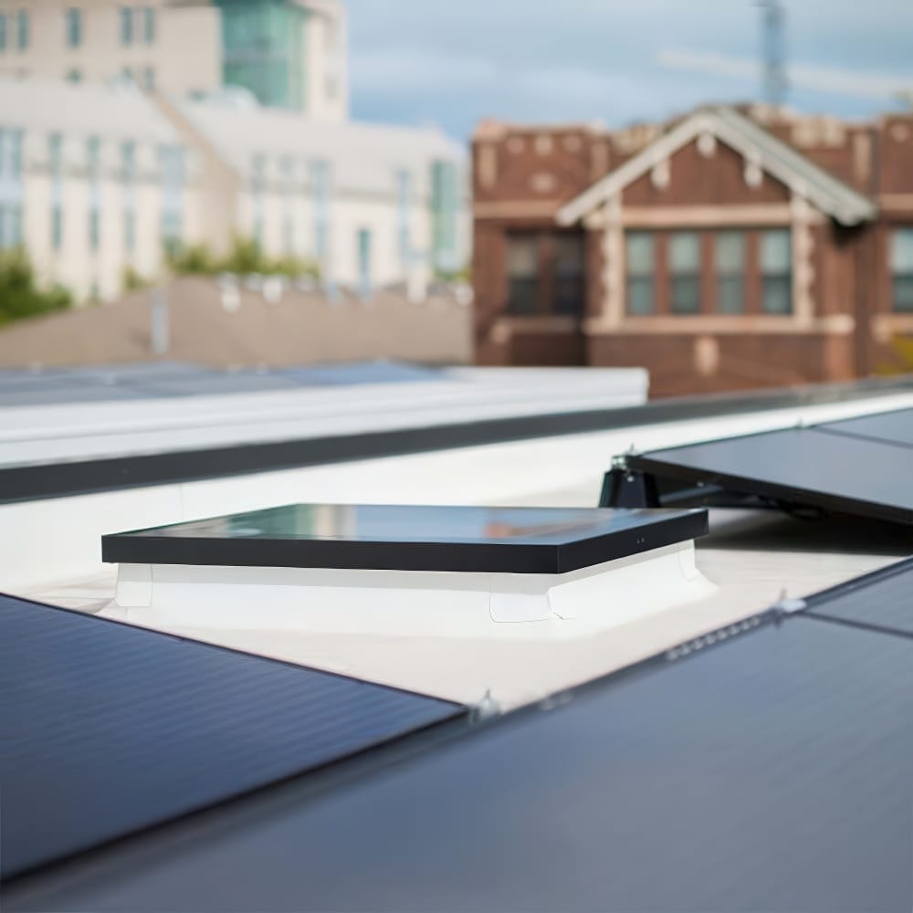 Closed Flat Rooftop Skylight Surrounded By Solar Panels