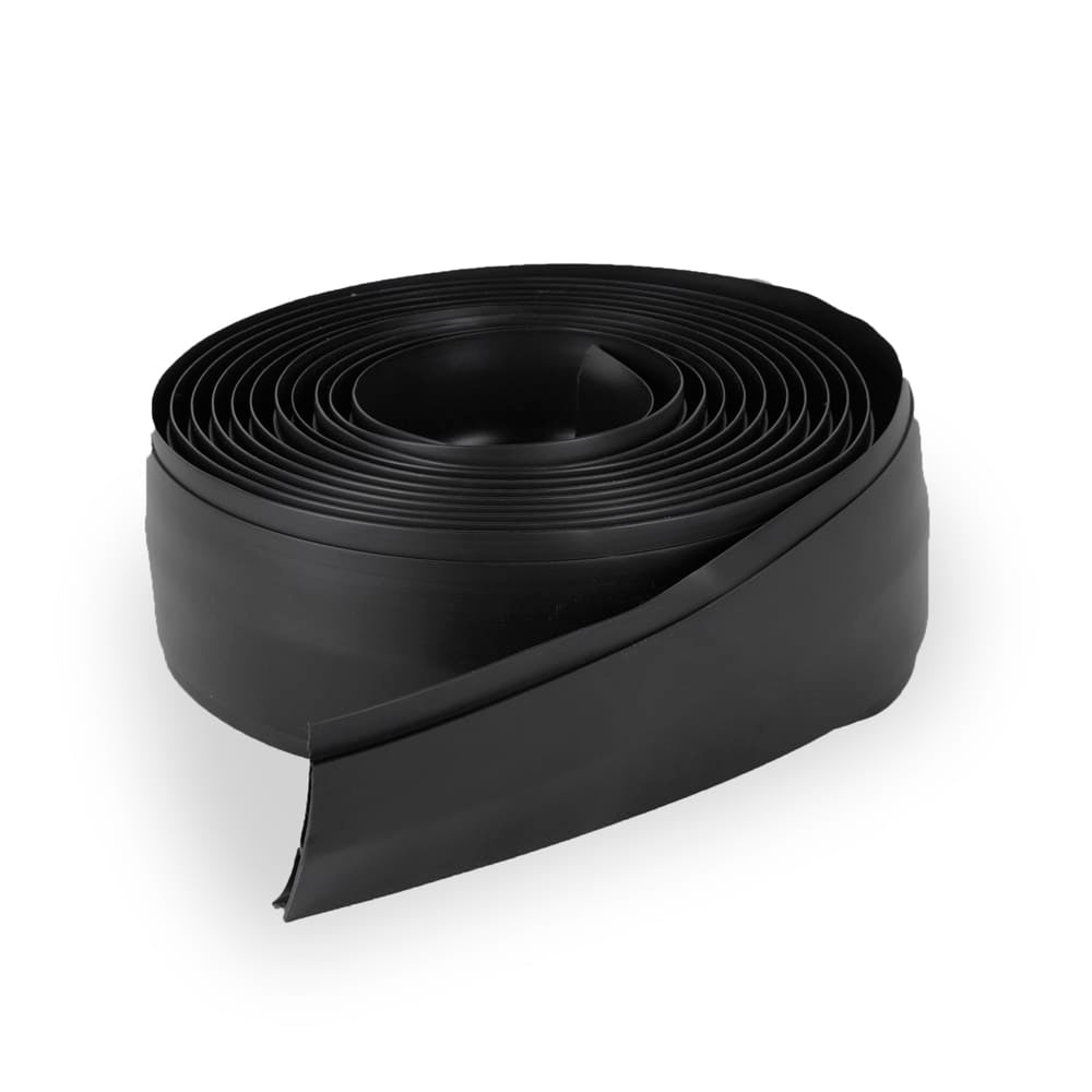 Coiled Black Center Strip G-Floor Resembling A Roll Of Flexible Edging Neatly Wound In A Spiral Pattern