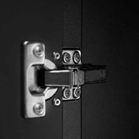 Detailed View Of A Sturdy Metal Cabinet Hinge Secured With Screws