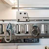 Detailed View Of AuxxLIft Garage Ceiling Storage Systems Highlighting Various Hooks And A Robust Cable Attachment
