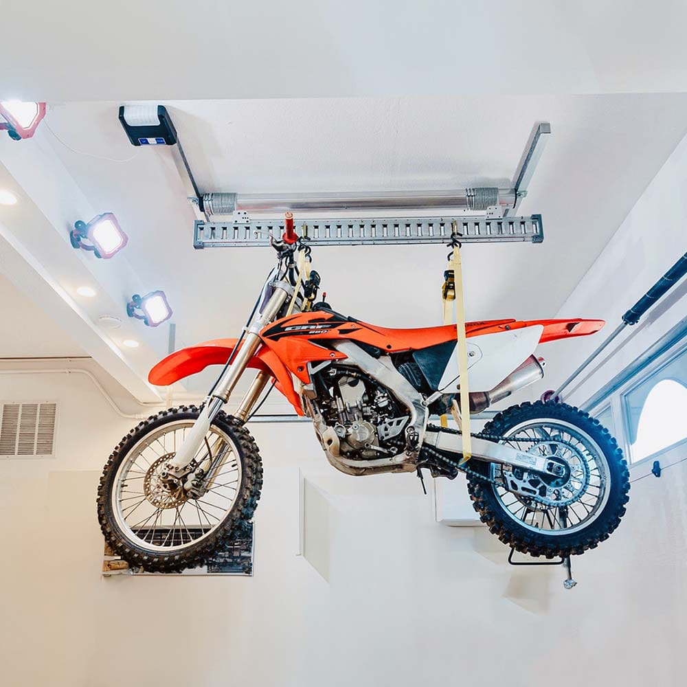 Dirt Bike Hoisted In A Garage By AuxxLift Electric Motorcycle Lift For Garage