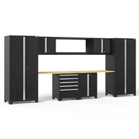 Full Wall Black Garage Cabinet Ensemble With Wood Worktop Central Tool Drawers And Tall Storage Towers On Each Side
