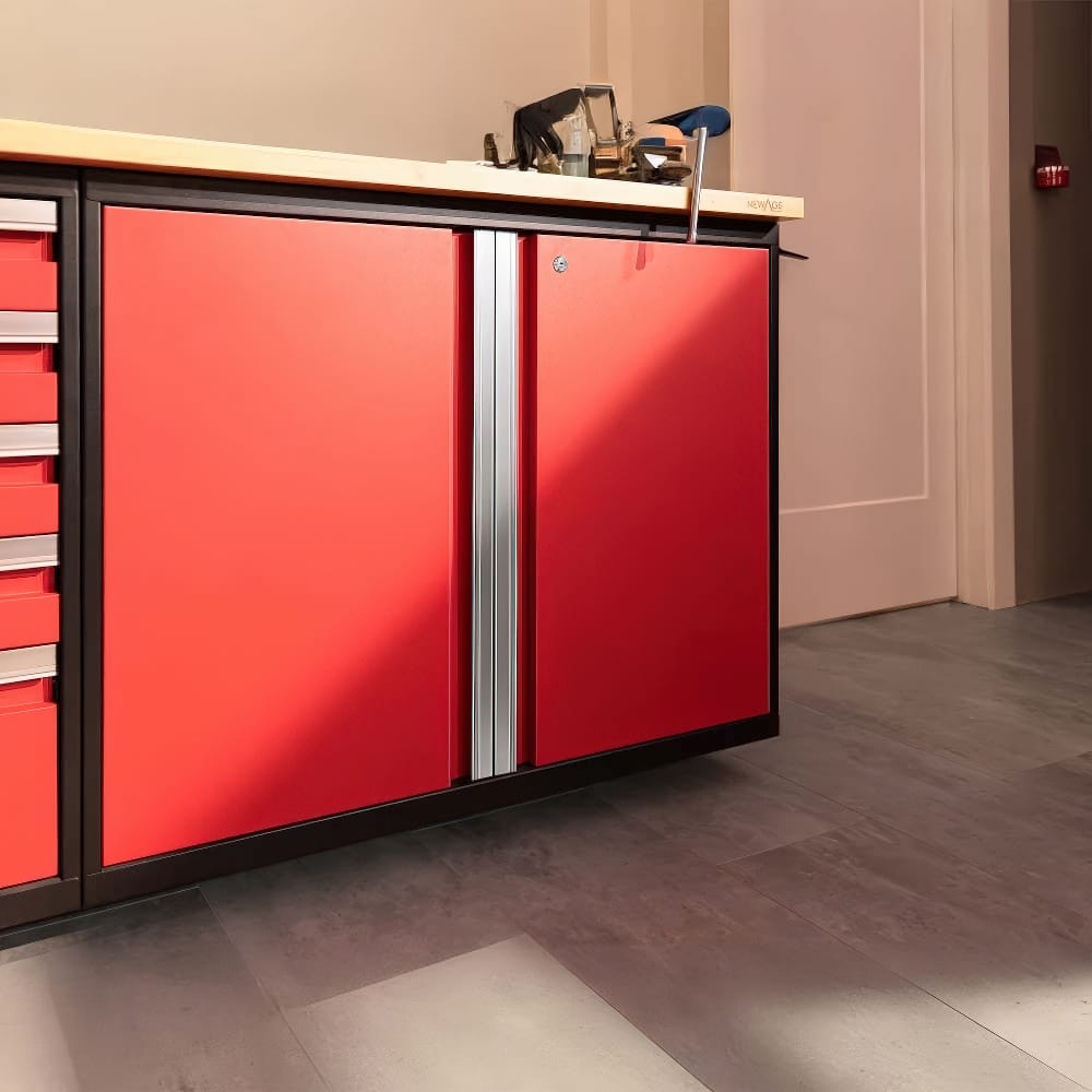 Garage Cabinet With Bright Red Double Doors And Wooden Worktop Adjacent To Matching Drawer Unit