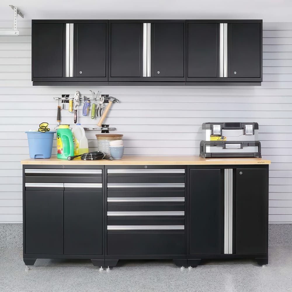 Garage Cabinets With Wood Countertop Hold Cleaning Supplies Tool Chests And Hanging Hand Tools Against A Gray Slatwall
