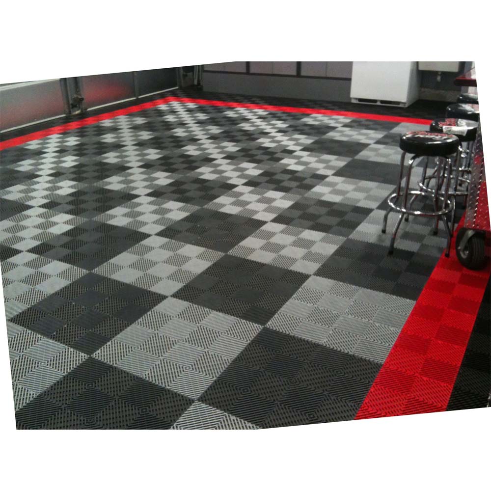 Garage Floor With A Checkered Pattern Of Black And Gray Racedeck Tiles Accented By A Bold Red Border