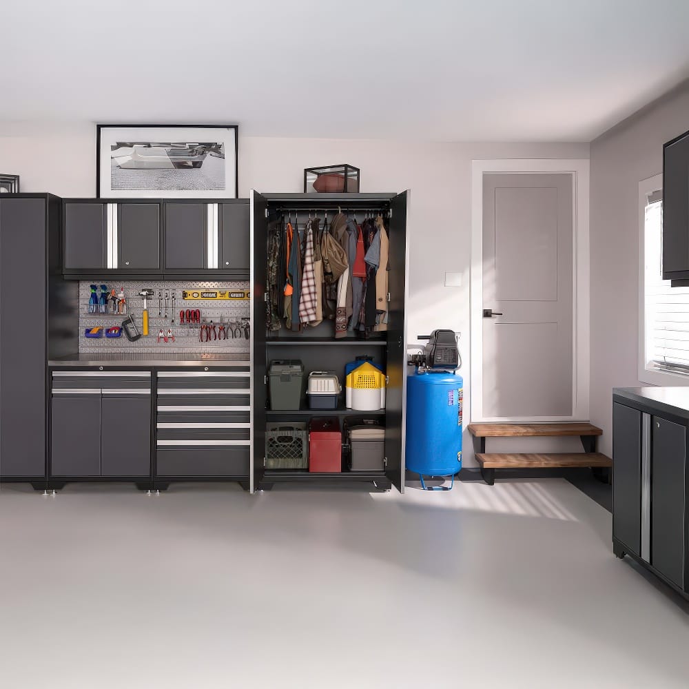 Garage Setup With Tall Cabinet Open Revealing Clothes And Storage Bins Beside A Workstation With Tools And Organizers
