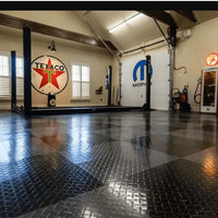 Garage With A Checkered Racedeck Tuffshield Tiles Along With Various Tools And Equipment