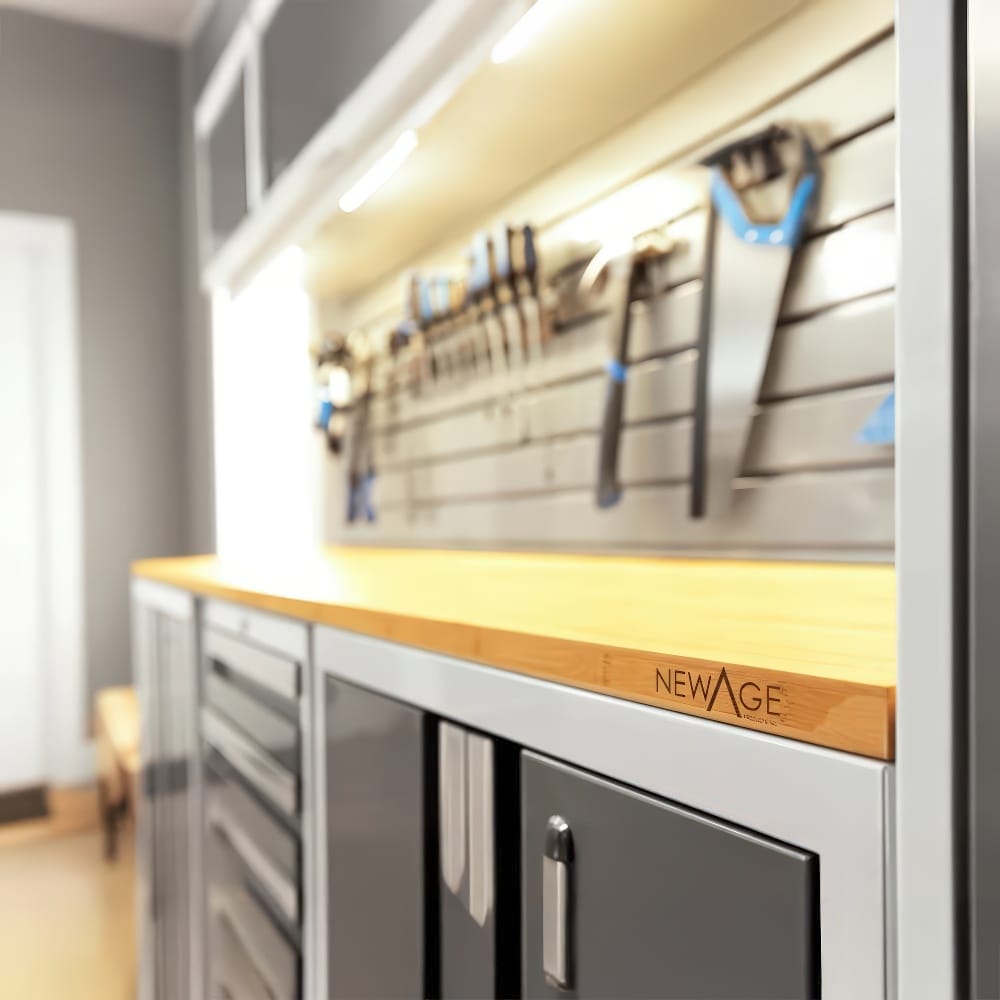 Garage Workbench Highlights The Sleek Wooden Countertop Tool-Filled Slatwall And Modern Grey Cabinets