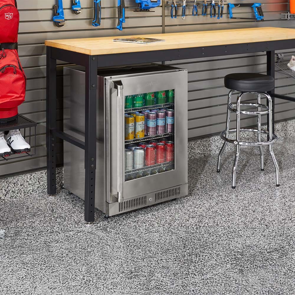 Garage Workbench With Built In Stainless Beverage Fridge Chrome Stool Blue Wall Tools And Speckled Epoxy Floor