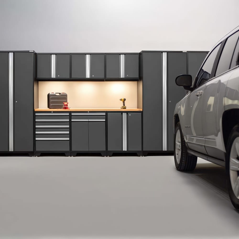 Garage Workstation With Illuminated Wood Top Surface Flanked By Tall Cabinets Drawers