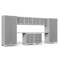 Gray And White Modular Garage Storage System With Upper Wall Cabinets Dual Tall Lockers A Central Workbench And A Drawer Unit