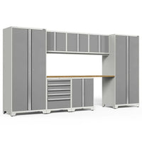 Gray Garage Storage System Combines Tall Cabinets A Wooden Work Surface Upper Wall-Mounted Units And Multi-Drawer