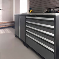 Gray Garage Workbench With Locking Door And Multi Drawer Tool Cabinet Below A Metal Backboard