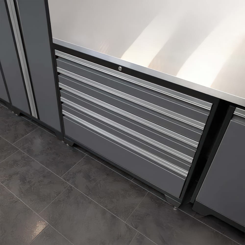 Gray Metal Tool Cabinet With Six Drawers Built Into A Workbench Setup