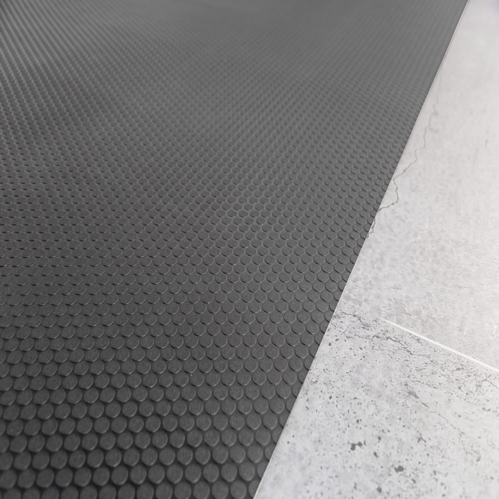 Gray Small Coin Flooring G-Floor With A Uniform Pattern Of Raised Circular Dots Against A Smooth Flooring