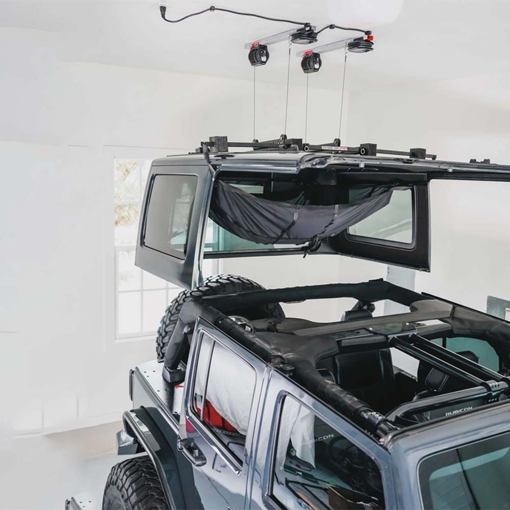 Lifted Off Hardtop Of A Jeep Suspended By A SmarterHome Winch To Remove Jeep JK Hardtop In A Garage