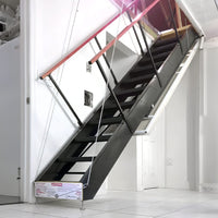 Majic Aluminum Attic Stair With A Red Handrail Extending From An Attic Or Loft Space Down To A White Tiled Floor