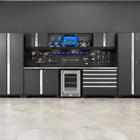 Matte Black Garage Storage System With Upper Glass-Front Cabinets Slatwall Tool Organization A Stainless Steel Mini Fridge And Integrated Drawers 