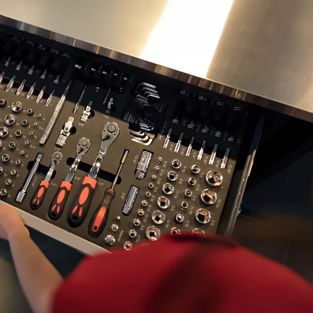 Mechanic Opens Foam Organized Drawer With Ratchets Sockets And Hex Keys Beneath Stainless Worktop
