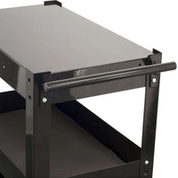 Metal Cart With 3 Shelves And Drawer With A Smooth Top Surface, A Tubular Handle On One Side, And A Visible Lower Shelf