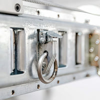 Metallic Locking Mechanism Of Electric Motorcycle Lift For Garage By AuxxLift On An Aluminum Case Emphasizing Its Robust Design And Shiny Texture
