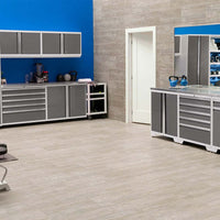 Modern Fitness Room With Grey Storage Cabinets Blue Accent Wall And Kettlebells On Worksurfaces