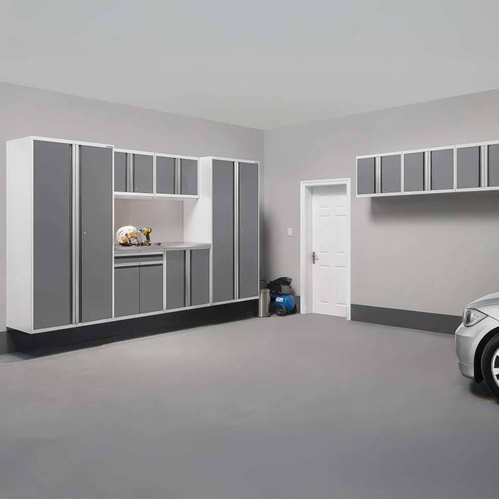 Modern Garage Interior With Wall-Mounted Gray And White Cabinets And A Compact Work Area