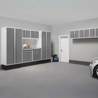 Modern Garage Interior With Wall-Mounted Gray And White Cabinets And A Compact Work Area