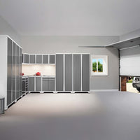 Modern Garage With White Framed Gray Cabinets In A Corner Workstation Open Garage Door And A Window Showing Green Trees