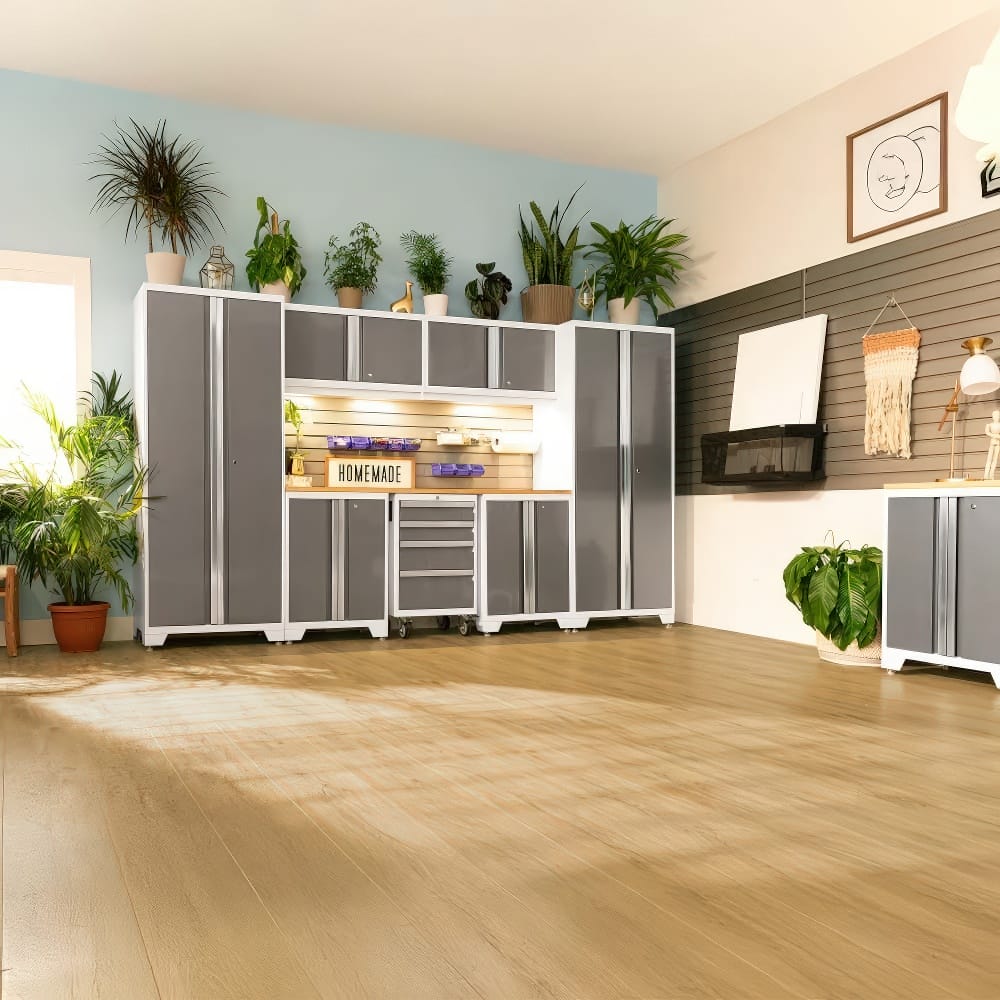 Modern Indoor Workspace With Gray And White Modular Cabinets And A Wood-Accented Workbench