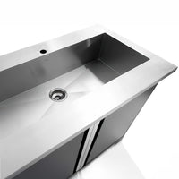 Modern Stainless Steel Sink With A Built In Cabinet And Center Drain Hole