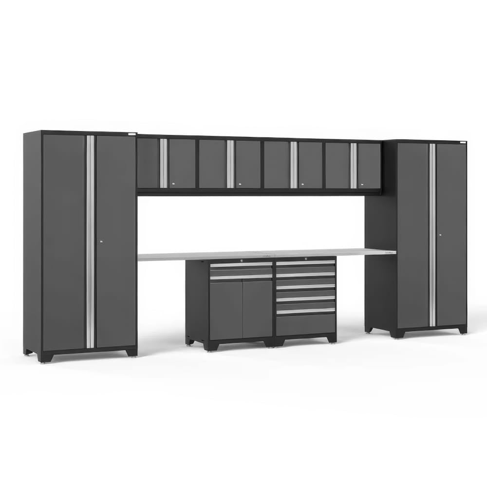 Modular Garage Cabinet System With Tall Towers Overhead Wall Cabinets And A Central Workbench With Drawer Storage