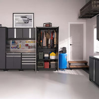 Neatly Organized Garage Featuring Grey Cabinets A Tool Pegboard An Open Wardrobe With Coats And A Blue Air Compressor Near A Step Up Door