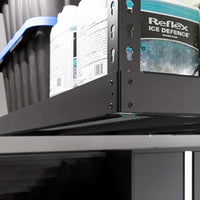 NewAge VersaRac Pro Overhead Rack 4 Ft X 8 Ft Height Adjustable In Black In A Storage Area Holding Several Plastic Containers