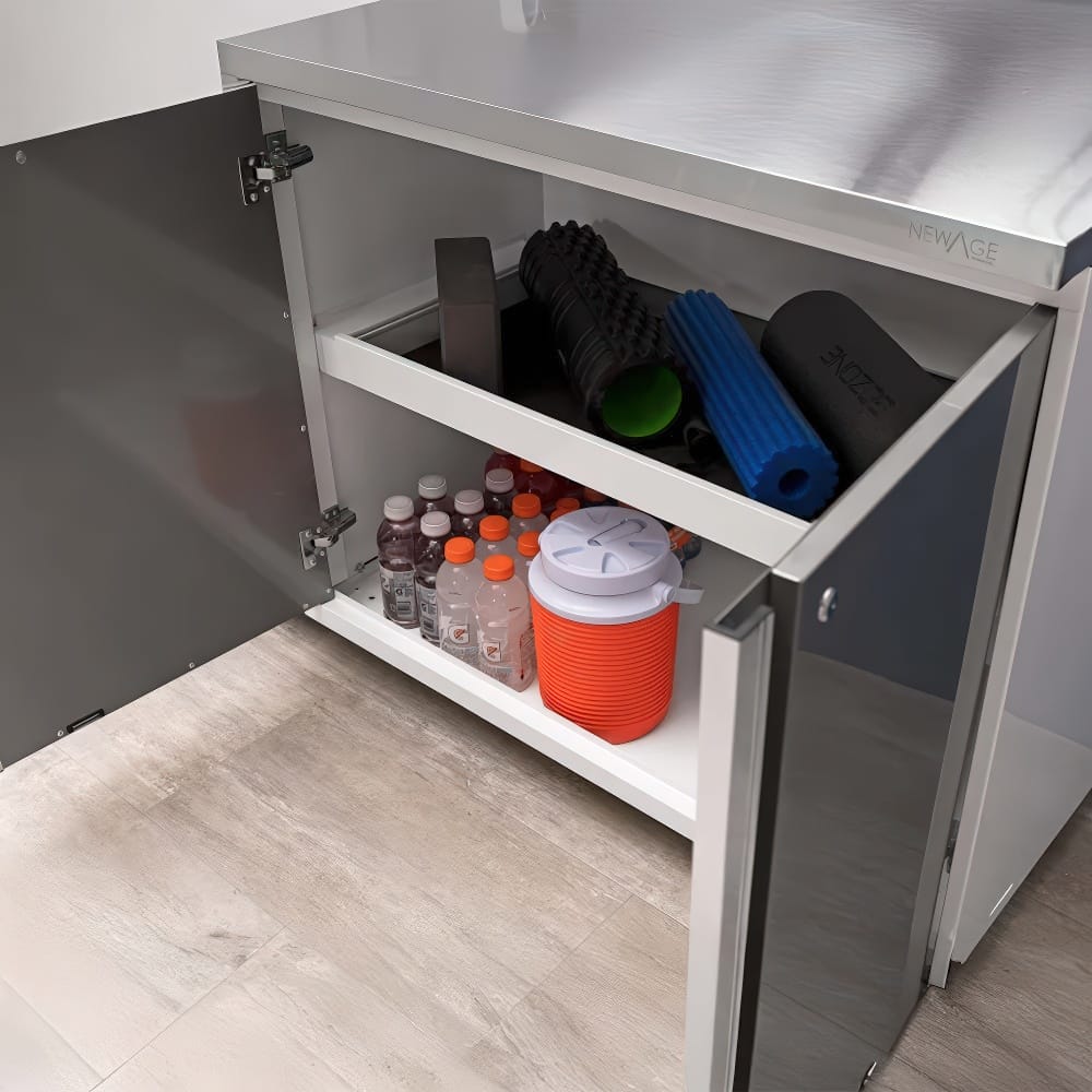 Open Cabinet With Stainless Top Storing Sports Drinks Cooler And Fitness Equipment On Shelves