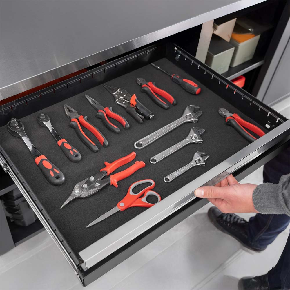 Open Drawer Shows Neatly Arranged Red And Black Hand Tools On Foam Liner Below Stainless Steel Worktop