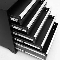 Open Metal Drawers Extend From A Sleek Tool Cabinet Showing Their Heavy Duty Slide Mechanisms.