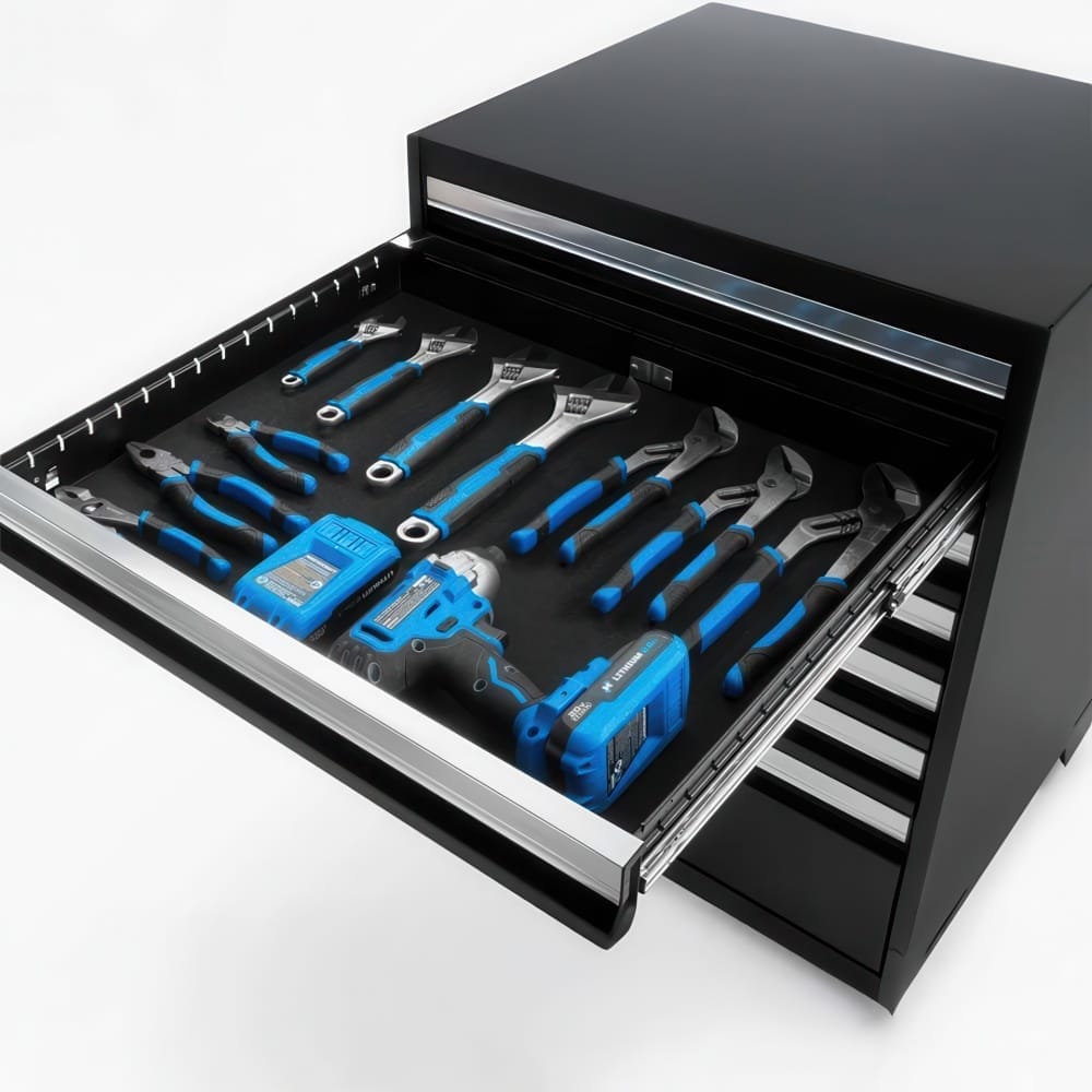 Open Tool Cabinet Drawer Neatly Organized With Blue Handled Pliers Wrenches And Cordless Drill Batteries On Foam Liner