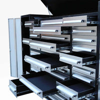 Open Tool Storage Cabinet With Multiple Silver Drawers Pulled Out