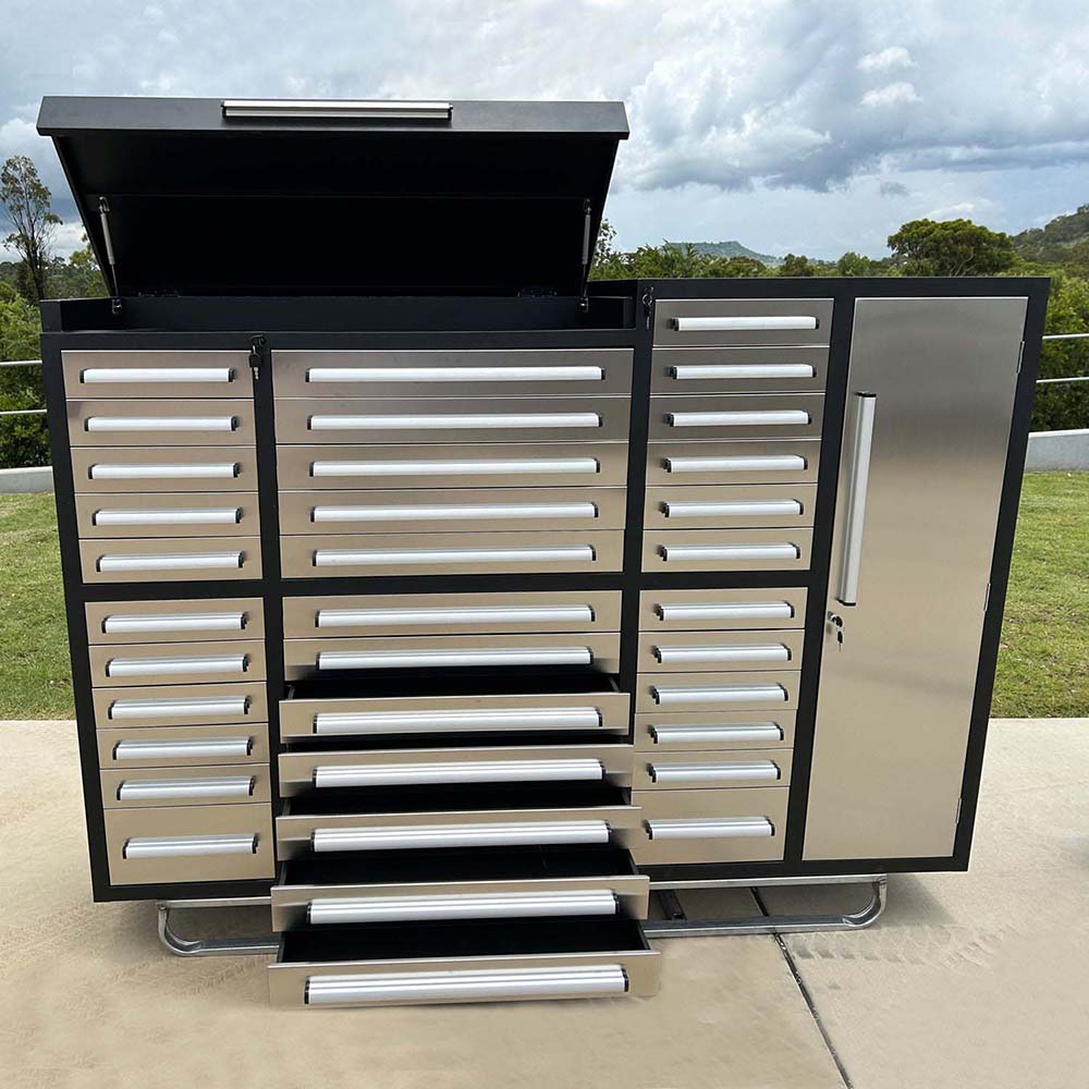 Open Top Outdoor Tool Chest With Multiple Stainless Drawers Pulled Out And A Right Side Locker Door