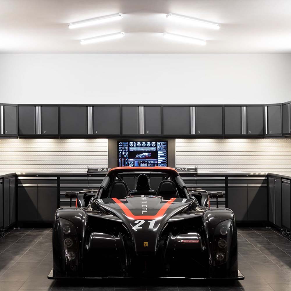 Organized Garage Featuring 42 Inch Tool Cabinet And 84 Inch Workbench Pro 3.0 Bright Overhead Lighting And A Large Digital Display Screen