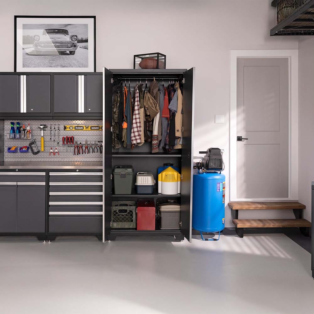 Organized Garage With Open Wardrobe Cabinet Tools On Pegboard And Blue Air Compressor Beside White Door