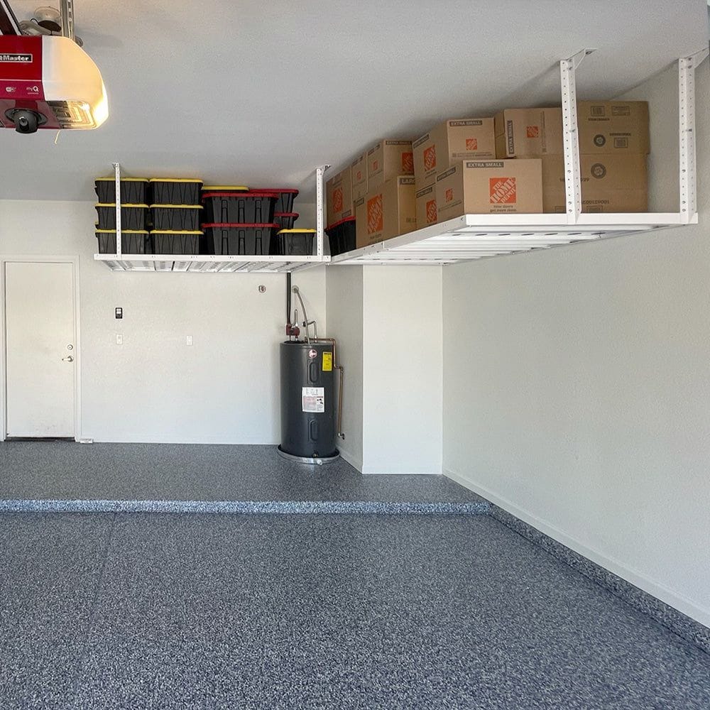 Organized Garage With Two EZ Storage Overhead Storage Rack Filled With Boxes And Black Storage Bins Installed Above A Water Heater