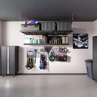 Overhead Storage Bins Mounted Shelves Holding Boots And Containers And A Pegboard Displaying Tools Hoses And Cleaning Supplies