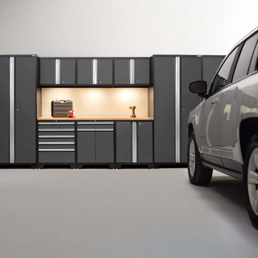 Parked SUV In Modern Garage Facing Dark Cabinet Wall With Lit Wood Workbench And Drawer Units