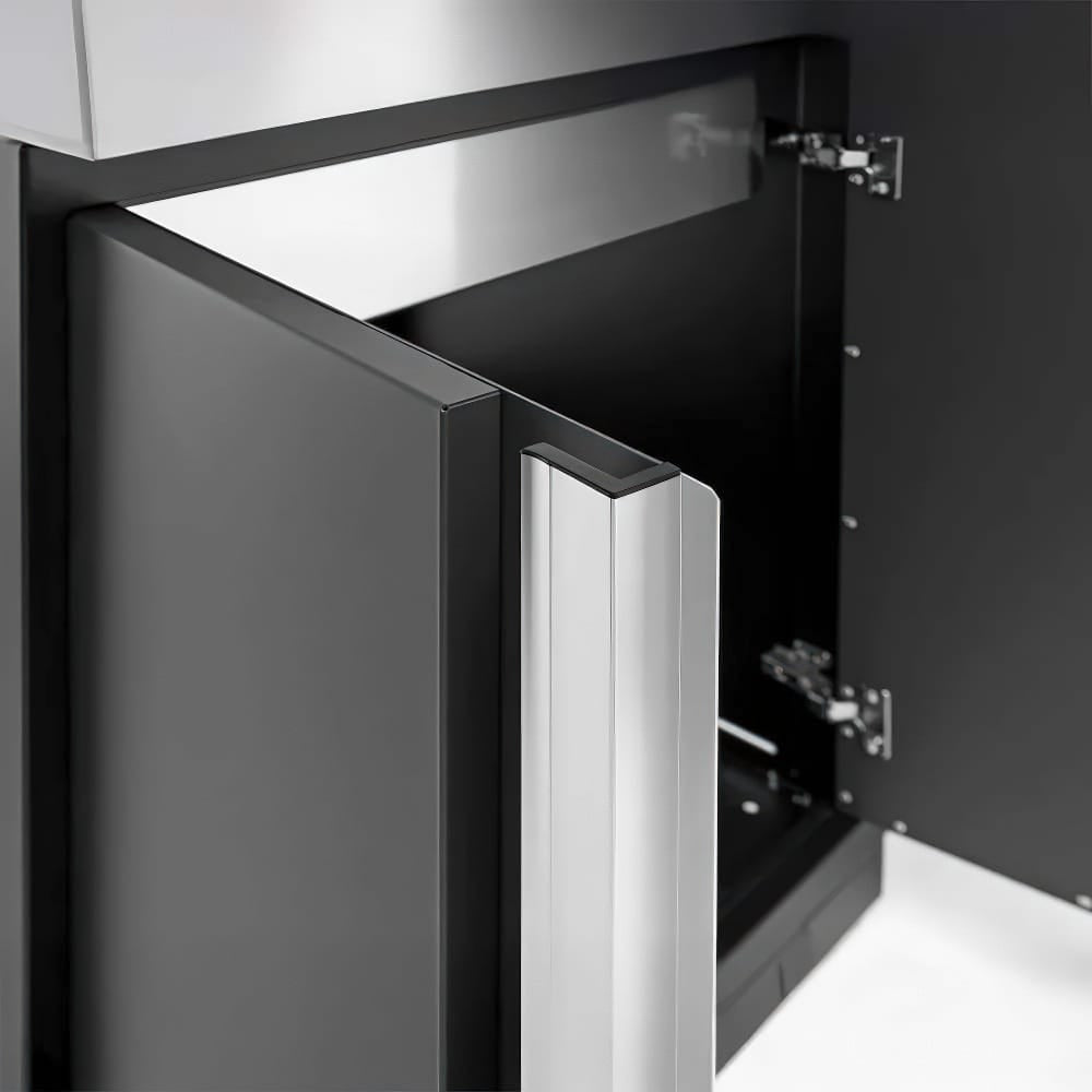 Partially Opened Cabinet Door Showcasing A Modern Silver Handle And Interior Hinges