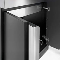 Partially Opened Cabinet Door Showcasing A Modern Silver Handle And Interior Hinges