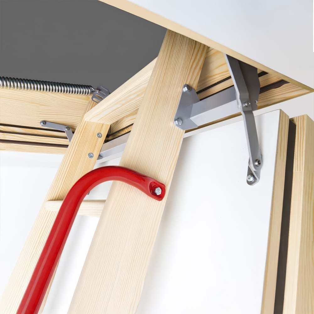 Partially Unfolded Wooden Attic Ladder With A Red Metal Safety Handrail And Spring-Loaded Hinge Mechanisms