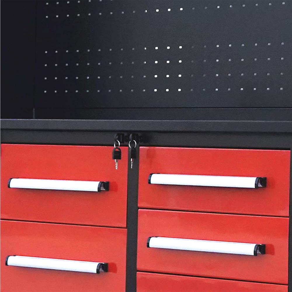 Pegboard Backpanel Above Red Drawers With White Handles And Keys